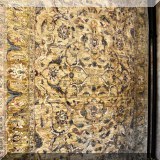 R18. Handknotted Oriental rug in shades of gold and green. 